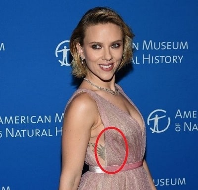 A picture of Scarlett's feather designed tattoo.